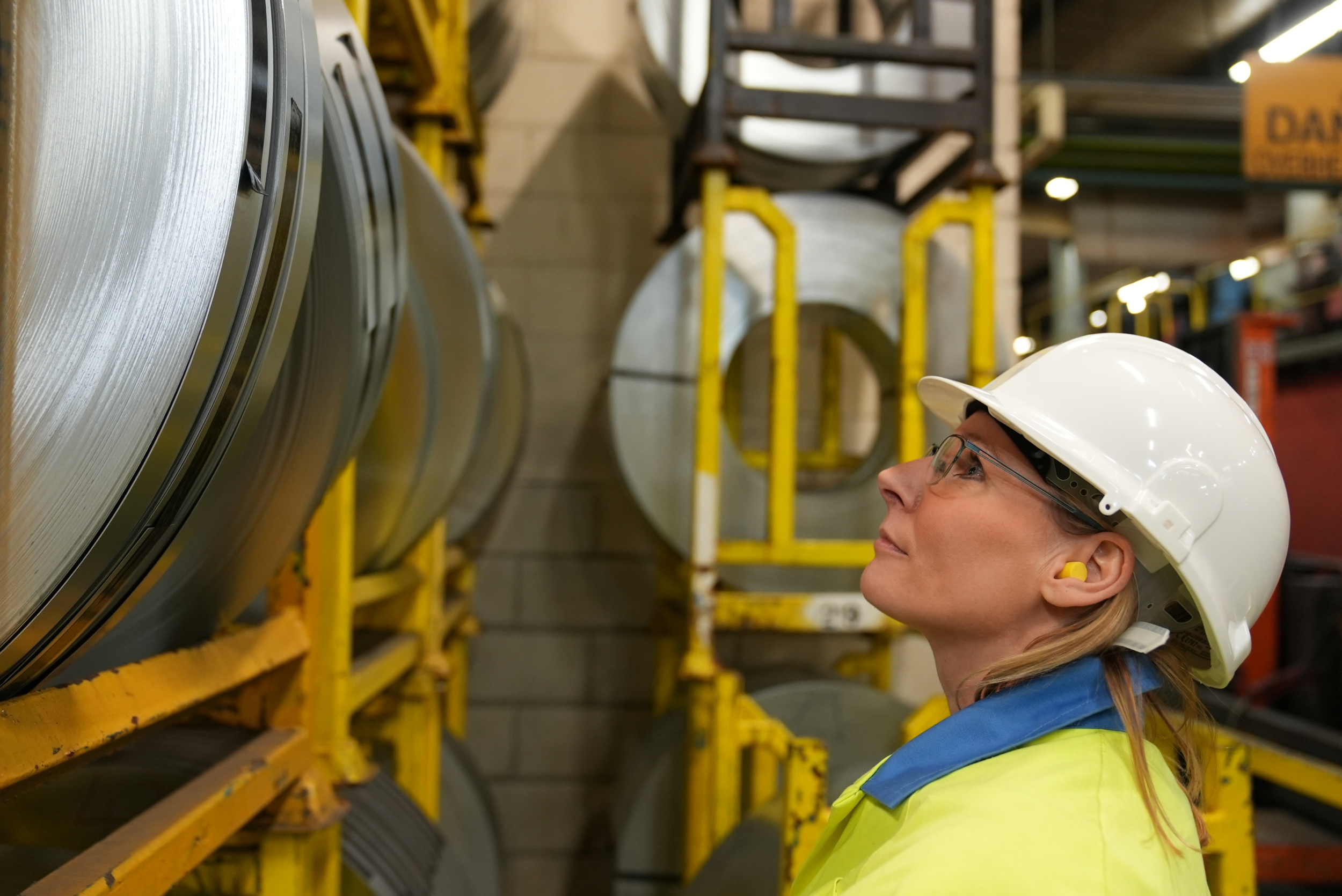 steel coil in bay being inspected