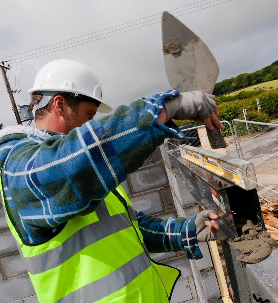 Builder installing a Catnic box lintel